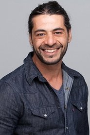 Tamer Burjaq as Ma-Ma Bodyguard in Dredd