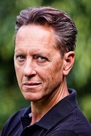 Richard E. Grant as Dr. Rice in Logan