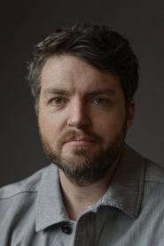 Tom Burke as Orson Welles in Mank