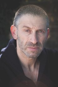 Mark Ivanir as Stovik in Kajillionaire